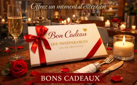 Un bon cadeau pour un restaurant, présenté avec une coupe de champagne, une rose rouge et une bougie allumée. Offrez un moment d'exception.